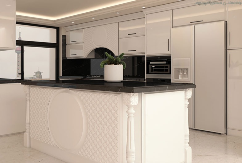 کابینت انزو کلاسیک با طراحی لاکچری، رنگ سفید براق، صفحه مشکی مقاوم و جزیرهای با حکاکیهای زیبا، ایدهآل برای آشپزخانههای مدرن و سلطنتی.